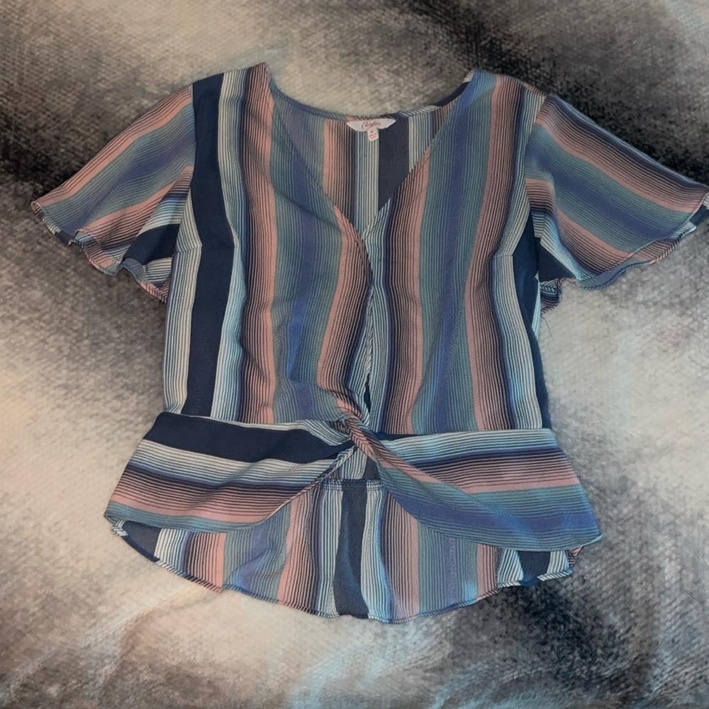 A variety of blues and pink strip top.